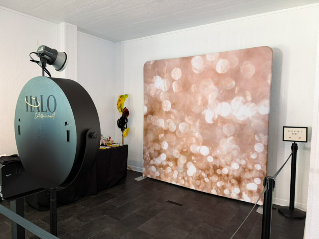 HALO Entertainment Services Photo Booth with gold sparkle backdrop